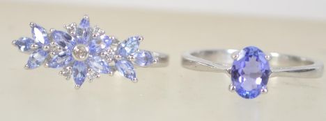 Two silver 925 ladies dress rings one having cz and purple stones the other having central oval cut