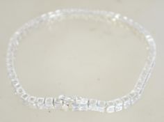 A 925 silver tennis bracelet with hidden clip clasp and safety catch. Weight 14.3g.