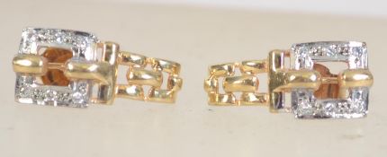 A pair of 9ct gold Art Deco style earrings set with clear stones and post backs. Measures 1.5cms.