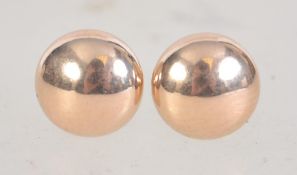 A pair of 9ct gold stud earrings in the with post backs. Marked 375. Test 9ct gold.