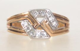 A Art Deco 18ct gold diamond ring with geometric hexagonal design with channel set diamonds.