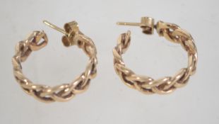 A hallmarked pair of ladies 9ct gold hoop earrings of rope twist form with post backs.