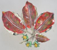 A 1960s goldtone and enamel beech nut brooch from the leaf series by Exquisite.