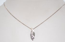 A 925 silver necklace with clear stone pendant. Measures 16 inches.