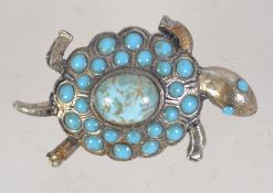 A 1960s goldtone metal brooch in the form of a terrapin set with faux turquoises with rollover