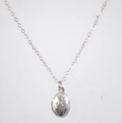 A 925 silver necklace with locket pendant. Measures 16 inches.
