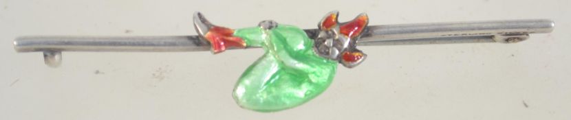 A vintage sterling silver and enamel bar brooch with figure of a pixie having a clip clasp.