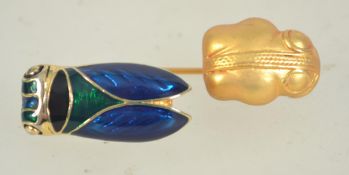 A vintage cicada enamel brooch together with a gold plated beetle pin.