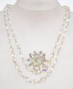 A vintage AB crystal necklace and brooch .