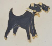 A vintage yellow tone metal enamel and rhinestone figural brooch in the form of two terriers having