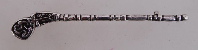 A silver figural brooch in the form of a pipe. Measures 3 inches.