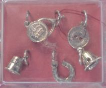 A set of 6 sterling silver Christmas pudding charms complete in original packaging.