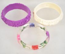 Three vintage plastic bangles.
