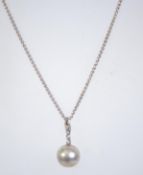 A 925 silver necklace with ball pendant. Measures 18 inches.