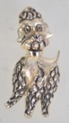 A 1960s goldtone metal poodle brooch with loop clasp. Measures 6.