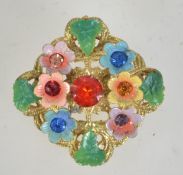 A 1950s Czech filigree and enamel brooch with rhinestones having loop catch. Measures 4.