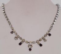 A vintage prom necklace and brooch set the necklace having a spring hoop clasp and the brooch a