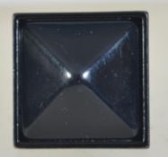 A vintage Art Deco black bakelite tetrahedron ring.