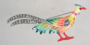 A vintage silver tone and enamel brooch in the form of a pheasant with marcasite set feathers and