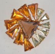A 1960s abstract rhinestone brooch with claw set triangular rhinestones with goldtone settings and