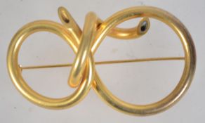 A vintage large twisted figure of eight brooch with roller clip clasp. Measures approx 8 inches.