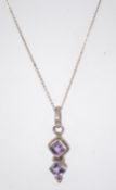 A 925 silver necklace with purple stone pendant. Measures 18 inches.