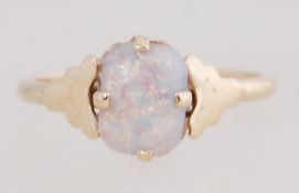 A 9ct gold ring marked 9ct set with an opal style stone. Size M.5. Tests 9ct gold.