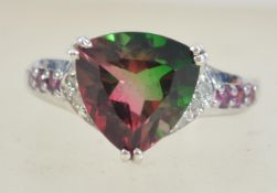 A 925 silver ring set with a faceted multi coloured stone. Marked 925. Size V.5.