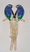 A vintage gold tone enamel and rhinestone figural brooch in the form of two birds of paradise with