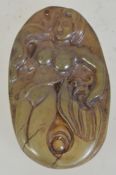 An agate pendant with carved mermaid figure. Measures 5.