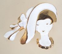 A vintage gold tone and enamel brooch in the form of a lady with roller clip clasp. Measures 5 cms.