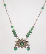 A 1930s Czech necklace with green glass beads. Measures 43.
