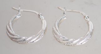 A pair of 925 silver hoop earrings marked 925.