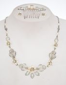 A vintage silver tone necklace earring and hair comb suite set with seed pearl and rhinestones.