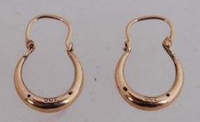 A pair of 9ct gold creole earrings with lever clasps. Marked 9ct. Tests 9ct gold.