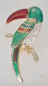 A large goldtone enamel and rhinestone set figural brooch in the form of a Toucan. Measures 7.5cms.