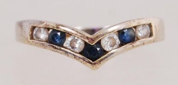 9ct gold wishbone ring set with sapphire and CZ. Hallmarked London import. Size K.