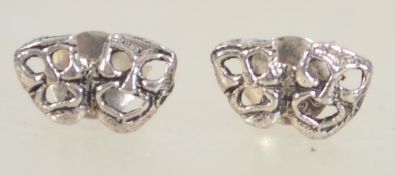 A pair of 925 silver earrings with theatre comedy and tragedy masks and post backs.