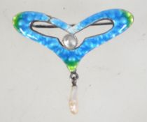 An Edwardian Art Nouveau enamelled silver brooch with blister pearl and baroque pearl pendant drop