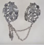 A large 1960s heraldic double brooch with chain and pendant drops and rollover catch. Measures 16.