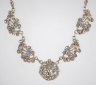A vintage AB rhinestone set necklace with stylized bow hook clasp. Measures 16 inches.