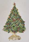 A vintage enamel and rhinestone Christmas brooch in the form of a Christmas tree made of holly with
