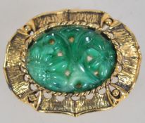 A vintage gold tone peking glass brooch with roller clip clasp. Measures 4.5cms.