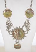 A vintage agate cabochon set festoon necklace on woven metal military style chain.
