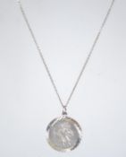 A 925 silver pendant necklace with a St Christopher drop pendant. Measures 17 inches.