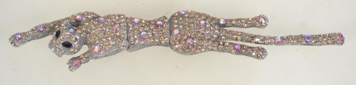 A vintage silver tone large rhinestone set panther shoulder brooch. Measures approx 7.5 inches.