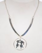 A 1970s silvertone metal necklace.