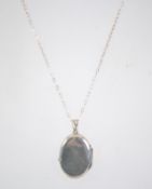 A 925 silver necklace with locket pendant. Measures 17 inches.