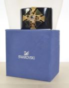 A boxed Swarovski crystal clamper cuff bracelet set with large crystal and enamel stepped Maltese
