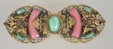 A Czech filigree belt clip clasp set with rhinestones and pearlized glass. Measures 8cms.